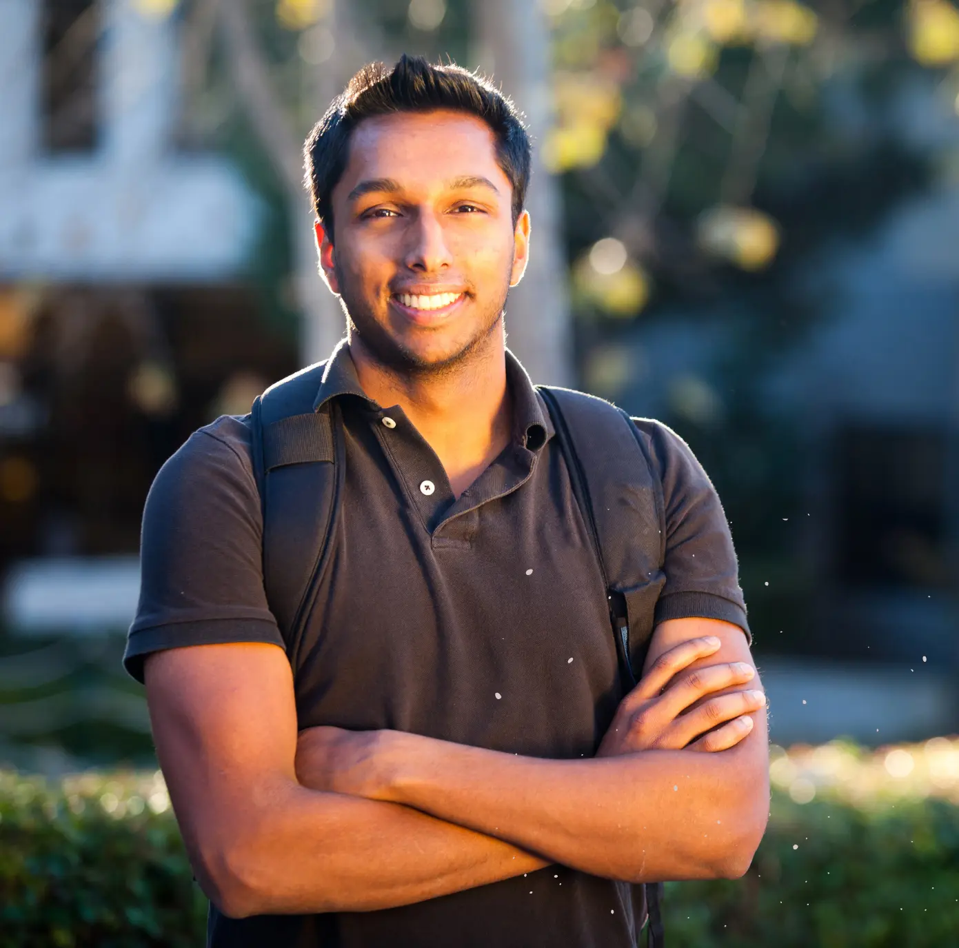 student standing with bag